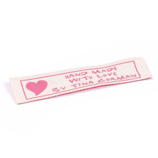 Tina Gorman pink on white clothing label