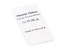 Pawsie Pillow care label with icons